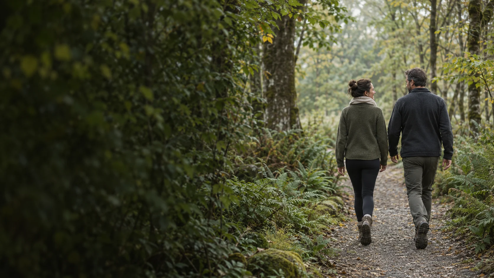 A quiet walk together along a green woodland path